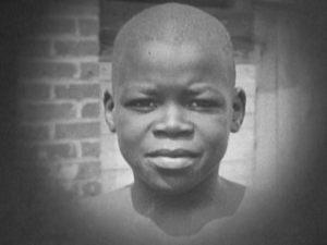Still from a 16mm film by H. Lee Waters of a young Black teenager. Reused in the film Conjure Bearden by Tom Whiteside