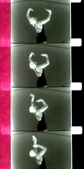 Film strip showing woman swimming. Old 16mm B&W film